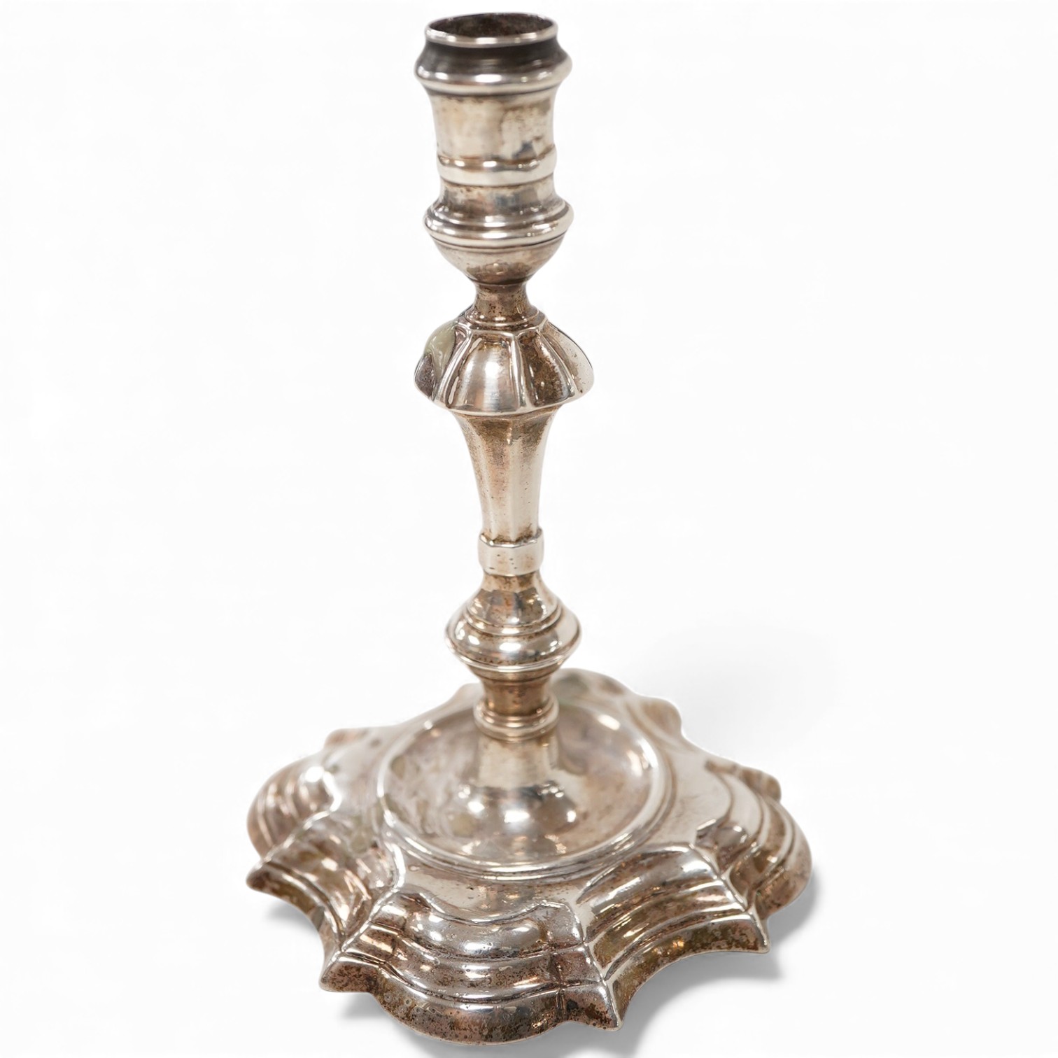 A George II silver taperstick, maker probably Richard Gosling, London, 1738, 99mm, engraved 'I. Alexander' to the base.